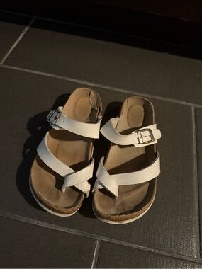 Women’s White Strappy Buckle Sandals well worn